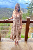 I love this dress, I wore it to a wedding and everyone was obsessed. I have a smaller chest (34b) and it was very low cut so there was a lot of cleavage. Anyone with a larger chest be warned! The lace back does loosen as you wear it no matter how tight you tie it which contributes to the cleavage. High quality material and very flattering overall. - Shelby F.