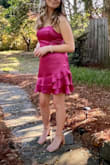 Daughter wore this for a semi-formal dance. It was lined and an appropriate length- not too short. The magenta color is even more beautiful in person. Satin material reflects the light. Truly an eye catching dress. - Amy E.