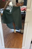 Originally bought a SM but it had a bit too much give in the hips and was too long, so exchanged for the XS, which is a better fit. It's still a little long but that's how it goes when you're 4'11''...pairing with tall heels should help, and since it has a TON of fabric, I might actually gather up some of it and tuck it into the waistband for a more casual look. As others have said, there isn't stretch in the waist band, and I worried it would be too tight, but it actually fits pretty well and isn't constricting. Color is lovely and true. Feels very breezy. Don't mind wrinkles in pic, haven't steamed it yet. - Suzanne F.
