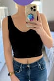 This is a good basic crop top. It is pretty tight-fitting, but the material is stretchy. You could size up depending on how tight you want it to be and the shoulder strap length isn't adjustable. It hits a bit lower than other crop tops, so it could work with high-waisted or more mid-waisted pants, etc. The lengths of the straps are pretty small, and it sits up pretty high under the armpit. It is isn't really sheer and can be worn without a bra (especially if you're smaller-chested like me). - Stephanie L.