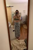 This is the perfect summer wrap. It actually zips closed on the side for a secure fit but the option to tie the twist as well for the look. - Emily K.