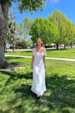I love this dress! It's so cute and the seams throughout the bust were very flattering and not uncomfortable. It was the perfect length for my heels, it didn't need any alterations. The slight floral pattern of the fabric and the sleeves made this right dress appear a bit more modest! - Leyna W.