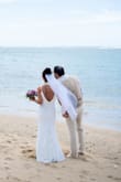 This dress has a stretchy material. I could have ordered an xs but I ended up keeping the small and having it altered. It was perfect for my beach wedding. Very elegant and classy. Very flattering dress. Had it altered to be a little more mermaid shaped and turned out beautifully. - Andrea U.