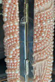 When I unwrapped it from the packaging there were a couple of loose pearls. I hung it up for my daughter to take to her formal. The day of formal, we realized the pearls had been dropping off the purse on the hanger for days. Never worn once, but looked terrible for her formal. - Maryclaire A.