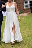 I love this dress. I felt like a beautiful bride & got so many compliments on it all night. The back is beautiful in pictures also. I loved the bodice, it felt like old Hollywood to me & the skirt w the skirt is just a tad sexy & the slip is just enough. Very well-made dress, very delicate. I loved it! All the gems were intact & held up to me steaming the dress (carefully) as well as all night. It was my #1 choice as well as everyone else who saw it against other dresses. BUY THIS! - Meegan R.
