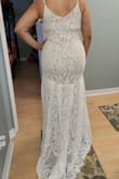 My wedding is not until July and I can't wait to wear this dress. It hugs your body in all the right places. It's light and airy; perfect for my summer wedding. My favorite part is the small train and the detail of the fabric. I'm 5'7 and the length is just right to wear it with 2" heels. - Gina M.