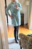 Runs slightly larger but it's probably just the cut. It's not flattering on a larger chest figure. Had quality issues with the seams under the arm. They were already coming apart! - Patricia T.