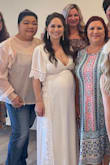 I used this dress for my baby shower! I got it hemmed because I'm so short, but it fit beautifully and I got endless compliments. It's a gorgeous dress. 

There is a part in the zipper that gets sticky (even with the dress off) but besides that, I loved this dress. - Heather S.