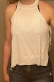 I really love this top as a cute, unique "hot young thing" summer top. I couldn't imagine wearing it without a bra since the knit of the shirt isn't fully tight/opaque, but you do you! Also, if I bend forward in this, my whole bust is definitely visible, but that's just the nature of the top. I've worn this with a bralette with tiny straps but I think it would look even cuter with a light-colored bandeau so the shoulder/neck area of the top could really shine and it wouldn't show through as much. - Kathryn R.