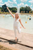 I loved this so much! I'm typically an L in Lulus clothing, but the white L was sold out. So as a tall girl, I went with an XL and boy was I wrong. There was a great stretch and fantastic material so the M was perfect. This was for graduation and I could not love this more. It's a great crop for us tall ladies and the V neck cut was just so flattering. Also.... I wore no undergarments for this. It was weird because it was thin enough to see the panty line BUT there are two layers so it was thick enough to rock without them. So ... I did without. I'm brave I know! I also bought the pink the other color but it washed me out and obviously, the white was better for graduation. OBSESSED! - Bridgette D.