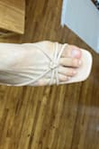 Like with most open-toe shoes, go down half a size.
I have beautiful wide feet and if you're like me and found these a little too tight, here's what I did. Untie/disassemble the straps completely. Then cut the little toe strap off (that comes up between the big toe and little toes). Yup just completely cut it off as best you can with house scissors. Then retie the leather strap back on with a cute knot of some sort. VOILA, you have an extra half-inch of room at least. I think it looks better actually. And you can't tell that it's been modified when being worn. - Leslie K.