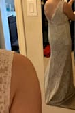 I have a straight figure with larger chest, so sizing up one would fit a little better on the waist. Dress is supportive without bra. Length needs to be altered. The lace is pretty with a little stretch. - Ariel K.