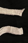 The finishing on this top is awful, huge knotted tangles in the lace, and the strap is sewn in a way that one side jutted out like a complete mistake. - Nayoun K.