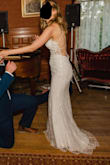 This dress is pure magic. I ordered a few other dresses from Lulus, but the second I saw this one I knew it was IT. I received a thousand compliments on it before and on my wedding day, and was thrilled with my purchase. It is insane that this dress is only $300, because it looks like something I paid way more for. 

I'm normally a size 6, but I had lost a little bit of weight and thought maybe a 4 might fit. But I ordered the 6 just in case - because I knew this dress might go fast online and 6 is the more common size - and instead had the back taken in an inch or so it fit even better. Also, since I'm so tall and wore 2.25" block heels with it, I did't even need to have the bottom tailored. 

I thought the lack of liner on the inside top would be an issue for photos, but it really wasn't. The glitter will get everywhere, but for me, it did't really matter. It's not that noticeable. If this bad boy is back on the website, snatch it up fast! Truly the best Lulus purchase I've ever made. - Kimberly K.