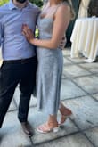 I went back and forth with this dress as I'm always dealing with my wider hips but I'm so glad I chose it. It's a true US medium so don't size up!! I'm a 6-10 and medium was perfect. I'm so glad I went with this dress for a wedding. It has the perfect amount of detail for a timeless look but isn't overly fancy. I attended a brunch wedding as part of the family and it fits that role perfectly - Devon F.