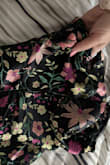 The dress is stunning to look at. The colors, flowers, and shape of it are gorgeous. But the quality is awful. I wore it once and not only did the fabric pull at everything, but it also ripped. Which made no sense bc it was loose in the bust. In fact, I was thinking of exchanging it for an XS, bc it was loose in the bust and the hips. Even before wearing it, there were issues. The fabric near the bust gathered and pulled. I'm a 34B, so I thought maybe I just didn't fill it out, but I don't think it's constructed correctly. I'd like to return it or something bc there's no reason a dress should look like this after one wear. - Roya N.