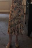 I'm 5'4" 119 lbs, always a reliable size 4 and this dress in a size Small fits like it was made for me. I have a smallish chest and full butt; I'm wearing the Soma Ultralite lift strapless, backless bra underneath. It works well. The dress has a built-in short (mid-thigh) slip underneath. The fabric and pattern are nice. I find this dress very figure flattering, shows off my waist and is sexy yet modest at the same time. The hem hits me at mid-calf. - Denise M.