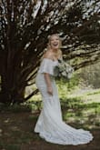 I bought this to wear for our elopement turned mini wedding and it was beyond perfect. It was gorgeous I got a million compliments and it is so comfortable! The quality and detail of the lace was super impressive. We wore matching vans and it was a little long but it still looked gorgeous, and I didn't mind walking around in the grass with it because it wasn't super overpriced. - Nicole K.