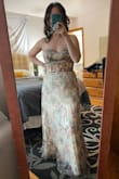 This dress is absolutely gorgeous. I ordered an 8, and the bad part is there is no give from under the corset where it zips. Which zips at the biggest part of your waist. It did suck me in a little and you can loosen the corset in the back, but I would keep in mind if you have a mommy belly like me, it is a little tight on the belly where it zips.  It is long, but I am used to getting most of my things hemmed since I'm 5'3.  It's an absolutely beautiful dress and received a lot of compliments. - Jessica J.