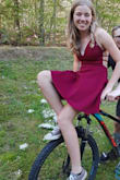This dress was stunning on my 14 y/o for her first semi formal! We probably could have used an XS as it was big through the back but gave room in the belly to eat middle school junk food! We ended up pulling the straps across to make an xtra X and stitched it. Solved the loose back. The material was far superior than we expected and the color was gorgeous ~ deep red wine almost. Kept its shape all night and looked adorable with low rise converse but could be dressed up with heels easily! Used adhesive gel backless bra for a bit more support as she is in between a B and C. Highly recommend!! - Shannon G.