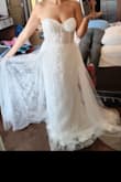 Made me feel like a princess. Loved the extra layer part in the back and the detail on the dress is gorgeous. The sheer bustier adds just the right amount of sexy without going overboard. No bra needed! - Lany K.