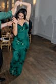 Got this dress for a wedding that was hosted on New Years Eve. Beautiful color, same as the picture and very comfortable. My only issue was that the back straps were in complete control of how well it sat on my bust. I had to tie it up pretty tight to hold my bust up and it was still casually falling down when I was dancing so I was pulling it up often. It's very form fitting which I loved, it shows your every curve so if you aren't comfortable with the appearance of your mid-section, wouldn't recommend. I would not say that it's slimming at all.
My pictures are a little out there but it shows how it looks when you're in motion, which is important if you're gonna be dancing in it! - Adriana T.