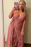 I bought this dress to wear to my friend's rehearsal dinner at her wedding. The color is beautiful & the pattern is really cute. I got lots of compliments. There are a few things to keep in mind before ordering- as many people have mentioned the sleeves are weirdly tight and do not have ANY stretch. I found that it was okay for short periods of time but would have been uncomfortable to wear for too long. Despite not being able to move my upper body, I don't think this was obvious to anyone else lol. It is a very low V so just beware if you don't like to show any cleavage. I took it to my tailor & she added a stitch on the top so that the top was a little less revealing. I typically am between a medium & large and the large worked well for me with this dress because of the sleeve situation. - Jaime G.