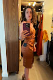 I read the other reviews and decided to order an xs, my normal size lulus dress, and a small since people were saying it runs small. Neither worked, the xs was too tight around my butt and thighs to the point I felt I could possibly rip the slit seam if I sat or bent over, but the stomach area was a little loose. I tried the small on and it fit nicely in the butt and thighs but again the stomach area was too loose. It has ruching on the side that made for loose material over the stomach, didn't help that I think it was made for people with bigger hips cause there was a lot of room in the hip area, but then it slimed in the thighs. I took it to a seamstress to see if she could fix it but she would have had to completely reconstruct it to make it work. Loved the silky material and color but ended up returning both of them because of the loose stomach material - Sophia M.