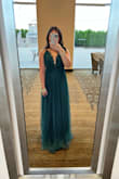 I loved this dress! I think the lace on the bodice pulled the dress together. People were complimenting the dress all night, especially the double slits that would show when I walked. I also loved how the back had adjustable straps. It was super comfortable, I wore it for like 10 hours. The color was true to the picture. It looks long in the picture because I didn't have time to have it hemmed before the event. I didn't need to wear a bra so I just wore stickies underneath and it was perfect. - Bich-Tam N.