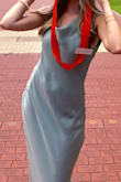 This dress is stunning and the fabric is great quality! However, there is no zipper, and no stretch to the material at all-- you need to have very small, flexible shoulders to get this over your head. I wore it for an event at my university, and allotted about 5 extra minutes to get it on. If wearing it to multiple events, it may be worth it to take to an alteration's place and ask for a zipper added. - Abigail W.