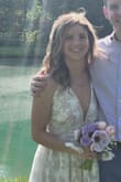 I wore this dress for my wedding rehearsal, dinner, & welcome party. It complimented my wedding dress and was very comfortable. I ordered it knowing I'd need to get it hemmed. If you get it hemmed, it might cost more than usual because there are several layers and it has to be hemmed from the waistline to save the beautiful scallop lace at the bottom. If you need a lot of support up top, this might not be the dress for you because of the low back (and front). The adjustable straps helped to make it a perfect fit. - Maia S.