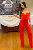 Absolutely love it! I ordered a medium I'm pretty tall and it ran long. I didn't need to have it hemmed though I just wore a heel. Got lots of compliments! Comfortable- it didn't fall all night like some strapless items do. It has boning to hold it in place. - Kristen K.