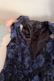 I am always a large but I sized down to a medium and it fit perfectly... HOWEVER I think I have a shorter chest area and it cut SO LOW. Like past the end of my sternum and I am all about a low cut... but you could see pretty much my whole chest and it was super loose too.
I easily solved this with getting a needle and black thread and sewing both sides by where the natural seam was and just overlapping it and it was perfect! Could not tell, even if you looked hard and took like 15 minutes (attached a pic).
Overall, the dress was so comfortable, flattering, and high quality. I was sooo bloated from traveling and it did not show at all and I didnt have to be conscious about sucking in all the time which was SO NICE. Also no bra was needed really, but will probably tape my boobs together next time to be completely slip proof. - Jillian R.