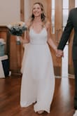 I love this dress and it was perfect for my small rustic wedding! I had to order in multiple sizes because it runs a little large, but it is so beautiful! I usually wear a small but the extra small fit perfect (length wise, both sizes were long and I needed minor hemming) I really wasn't sure how I felt about it when I ordered it, but was pleasantly surprised by how much I loved it! It is very low cut in the chest so I added a little fabric to give it more of a conservative feel, and also added a Lulus beaded belt to give it a little sparkle. I loved everything about this dress and it photographed beautifully in all my wedding pictures! - Michelle D.