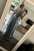 I am between a small and medium because I am smaller on top than on the bottom. Because of the flowy bottom, I decided to get a small and it fits perfectly! The length is long if I'm not in shoes but it will be perfect with 3-5" heels. The fabric is slick and the color is exactly the same as the photos. There is a slit right up the front center that I didn't notice in other photos. My sister thought it was a jumpsuit when I sent a photo! - Nicki K.