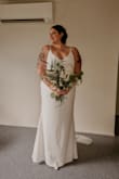 Overall it's a stunning dress, the material is thick but doesn't hide anything. You can see cellulite, outline of tummy, belly button etc. Which is my big insecurity. But this is my dress wedding dress. So simple and elegant. Timeless. I made it work with the right shapewear to smooth everything out. I cannot wait until I Marry in this. Highly recommend. Shipping was super fast to Australia also. - Jordan C.