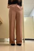 The pants are exactly as pictured. The fabric is light and airy, but feels and looks high quality. I love the blush color - as pictured on model (my photos look a little yellow). It's definitely high waisted, but not uncomfortable in any way. Deep front pockets. The pants might be a little long for someone short, but I am able to wear flats or heels. Definitely would recommend. - Tori R.