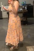 I ordered this dress to wear to a wedding and was very happy with it. I was afraid it would be too long but it was the perfect midi dress. I usually am between a large/medium size but medium fit perfectly for this dress, it is nice the back has some stretch to it! - Grace K.