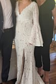 I wore this for my elopement and every passerby stopped and complimented my dress, a few even asked to take pictures of it. I'm short so I was worried about not having time to get it altered, but everything fit perfectly! I'm also 4mo pregnant, and I feel like the dress hid my tummy from the front. My husband was VERY happy as well. :) - Christina R.