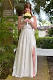 I Ordered this dress for our elopement in Jamaica and it was the perfect dress. It arrived very quickly, within 2 weeks and i live in Canada. The dress can be accessorized up or down depending on your setting.  I added a 'sparkly' belt as I felt I needed a bit more bling. I did have to have it taken in just a bit and shortened. But overall it was perfect!! - Jessica M.