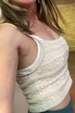 I am a 32/24 D depending on the bra. I wear XS dresses but they are snug on my chest if they are bodycon. I got a small in the tank that fit well without being tight. I probably could have done XS for a tighter fit. Like most crochet items it does stretch out a bit. I paired it with free people brami and the green high low skirt from Lulus. - Keri M.