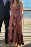 This dress is gorgeous and looks exactly as pictured. My only issue was I felt it was too low in the front; but that was an easy fix with a small safety pin. I wore it to a wedding and got many compliments. Highly recommend! - Kathryn B.