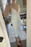 This dress was exactly what I was looking for my bridal shower! I think it's the perfect combination of sexy & classy! It's form fitting, but the material has some stretch so it is very comfortable. I did need to use some tape to keep the dress in place in the chest area, but I think that's just because I have small boobs. 10/10 would recommend this dress! - Casey M.