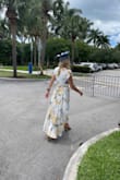 I bought this dress for my master's graduation and it was PERFECT. I got so many compliments and it was the perfect amount of sweet and a dash of sexy. It flowed beautifully in the wind when I walked. I live in South Florida so it's so so hot during the summer. This dress was light, flowy, and beautiful on me! Would highly recommend it. - Allison