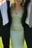 When I first tried it on I loved it, it was sexy and straight. Wore it to a wedding and I quickly realized that as I moved it bunched around the waist... a lot. I kept having to bring it down. I don't think I have a decent picture without looking wrinkled or pregnant. Not flattering at all. :( - Alexandra B.