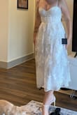 I like the dress but it's definitely a little bit tight and see-through on the skirt area. Other than that, I really like how it looks. I returned it. - Larissa F.