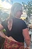 Very comfortable - I bought a Medium even though typically I wear a large to give it more of a crop top look.  It's still comfy!  Material is very stretchy and can be dressed up or down. - Kira W.