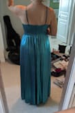 I truly feel like an ice princess in this dress. The only caveat is that it runs quite large. Based on my measurements I was likely to fit in an XL over a L but the comments made me go with the L. The dress was still huge and I needed it taken in and hemmed. It is also a bit on the heavier side. Otherwise, it's beautiful! Pics are after I got it taken in and hemmed. - Dayna W.
