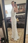 Ordered a small based on the little size survey offered by Lulu's. Based on the dimensions it fits nicely just too long. Not sure if that's intentional so it fits lots of different heights but even with heels on its still too long. I can get it hemmed but just be warned if you order give yourself enough time before important dates to get alterations. It also shipped very fast and came before expected delivery date which was nice. Altogether it was a good experience and I'm happy with the purchase! - Adriene O.