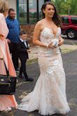 After reading previous reviews I ordered a size 4 although I usually wear a size six. It fit perfectly and didn't require any alterations. I wore my dress with 4 inch heals and it was the perfect length. The material was not itchy and I was comfortable in my dress all day. I received many compliments. People could not believe the price. - Andrea M.
